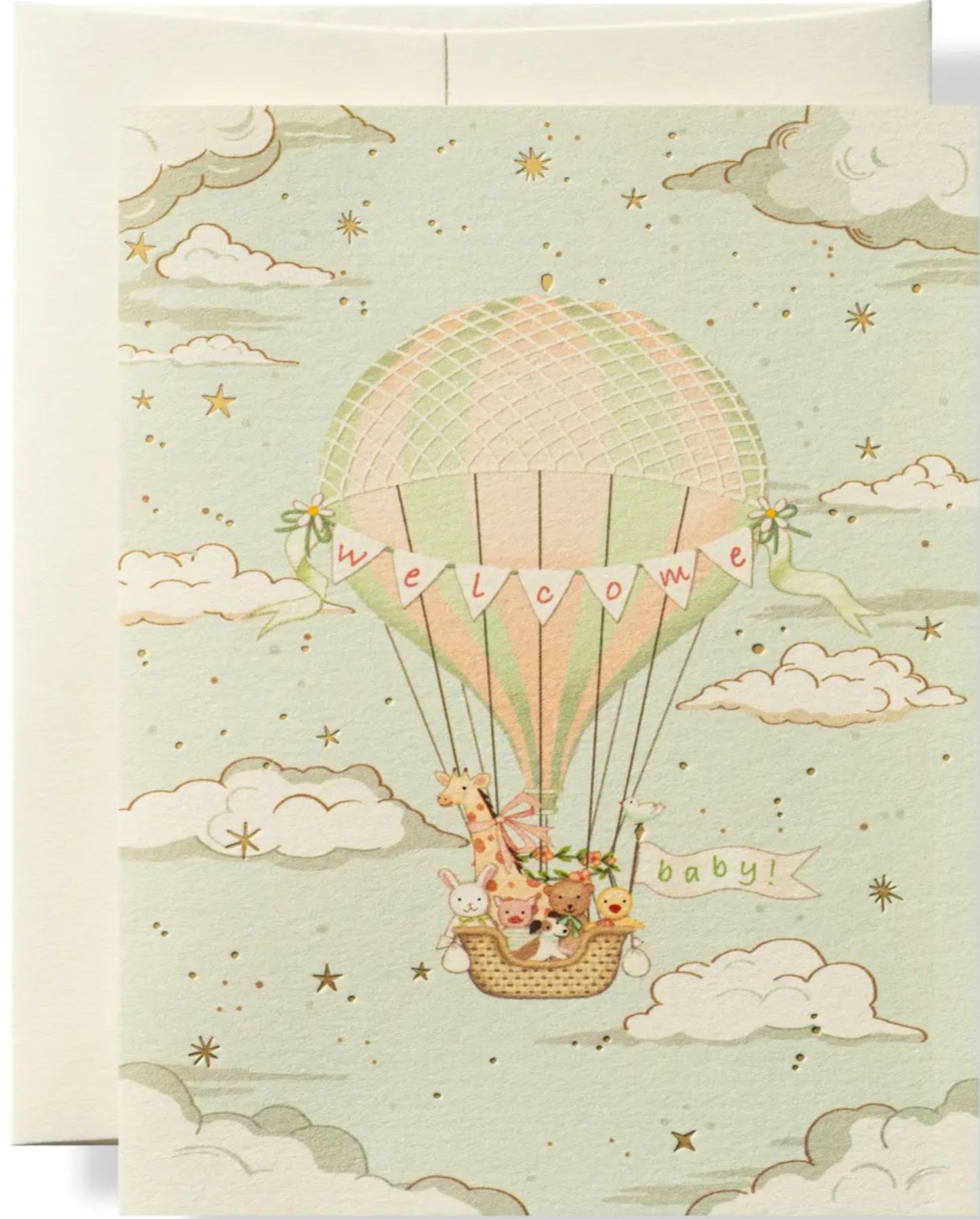 Greeting card with a hot air balloon and baby in the basket on a light green background.