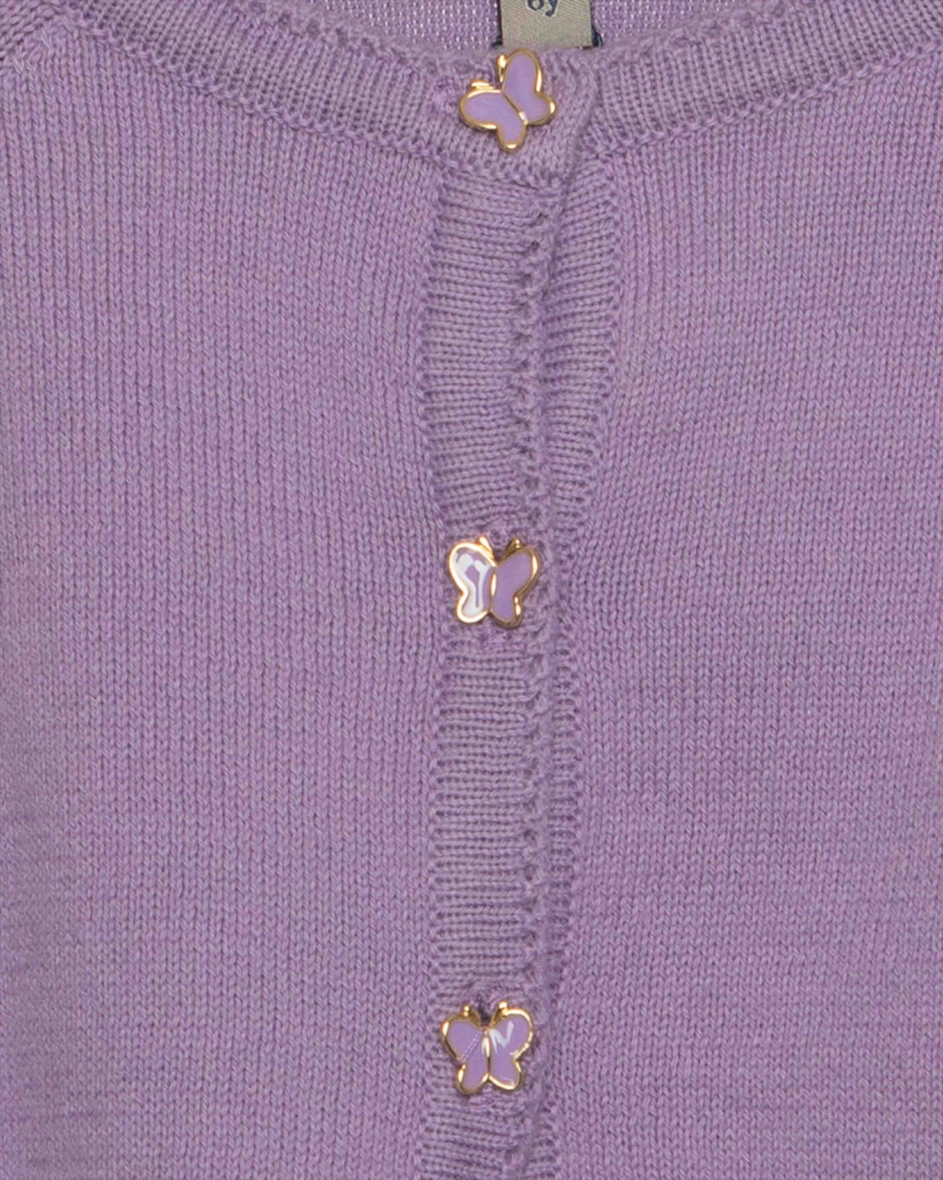 Close-up of a purple garment with gold butterfly embellishments.