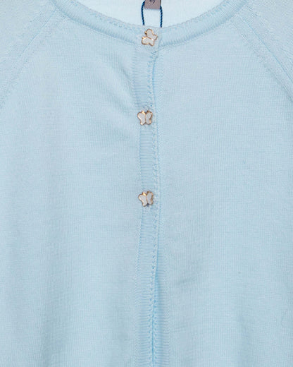 Light blue baby outfit with floral buttons and 'fleurisse' brand label.