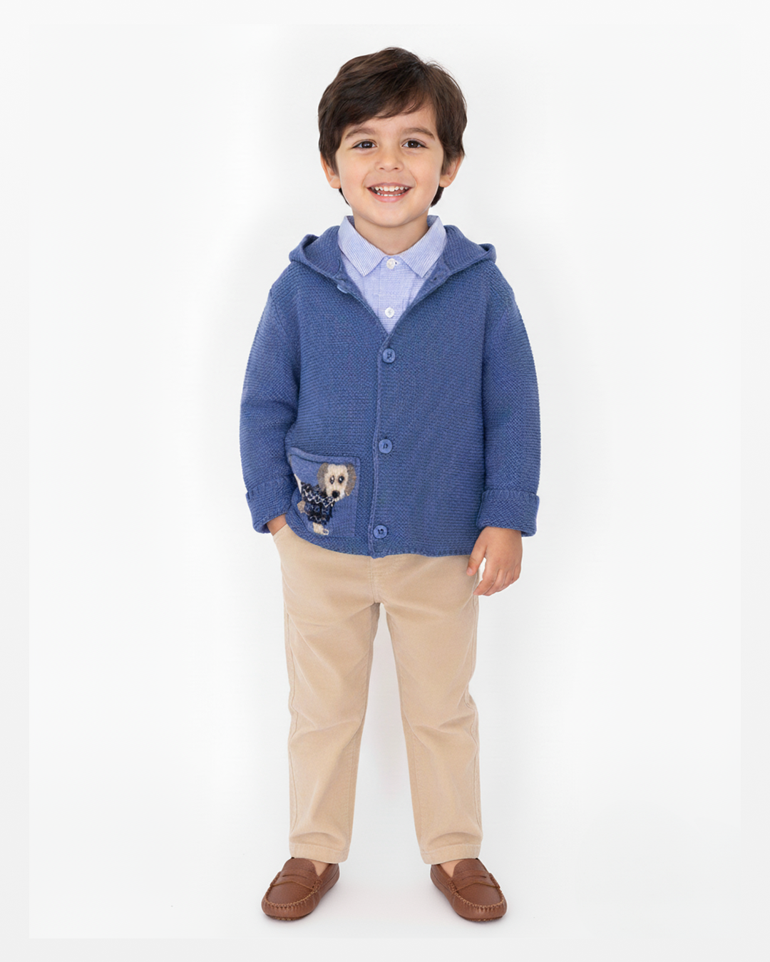 Child wearing a blue hoodie with a dog design on a white background
