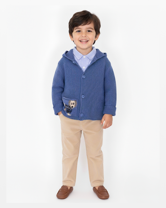 Child wearing a blue hoodie with a dog design on a white background
