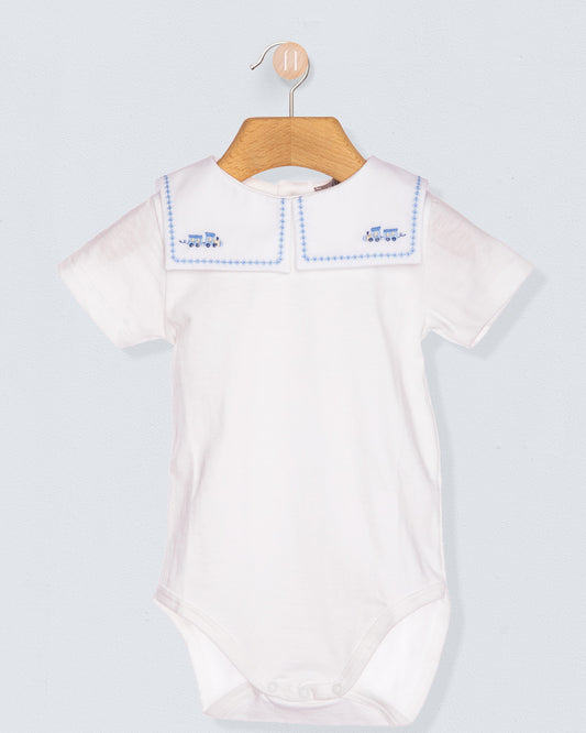 White baby bodysuit with blue trim on a wooden hanger against a light gray background