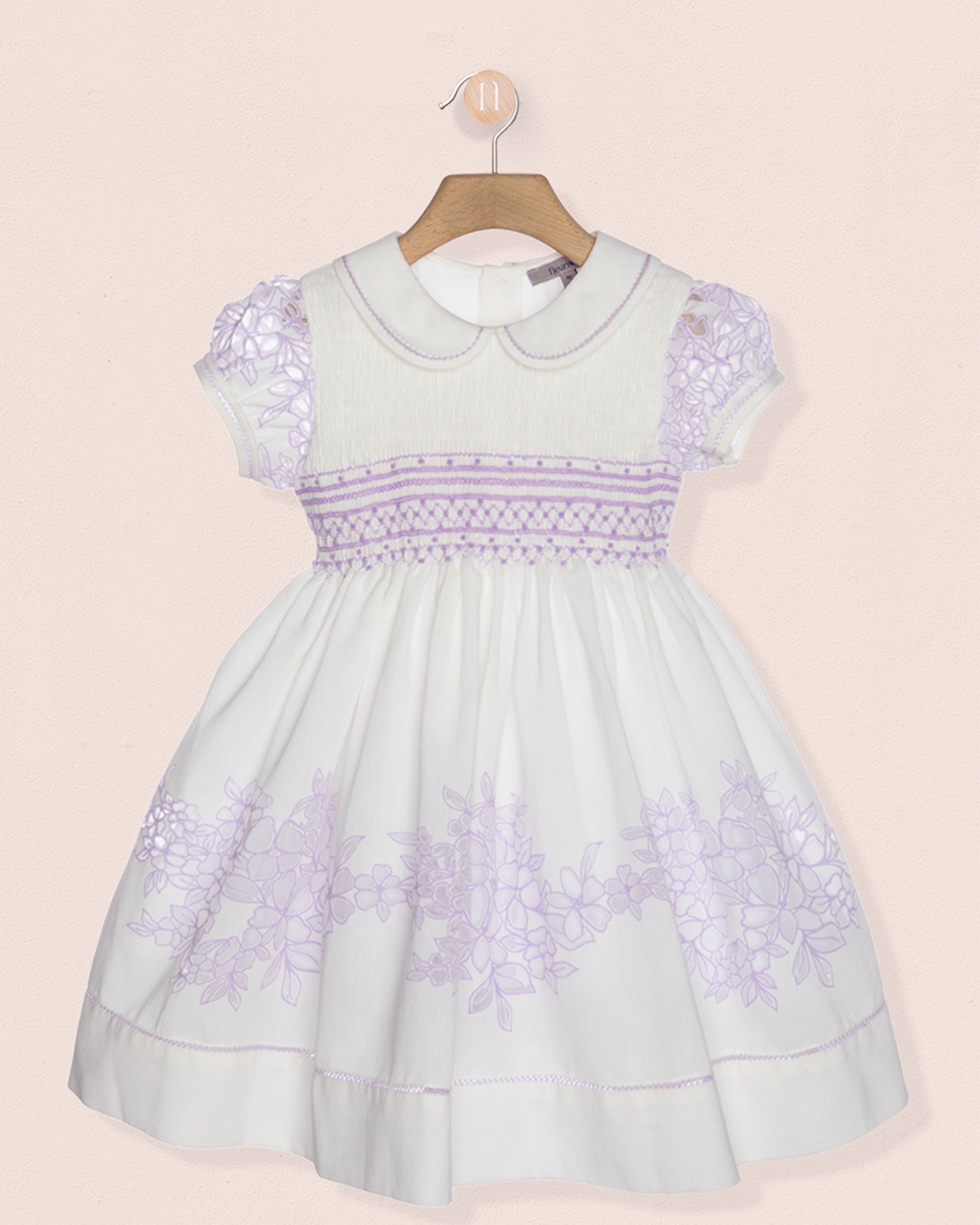 Light blue dress with purple floral patterns on a pink background