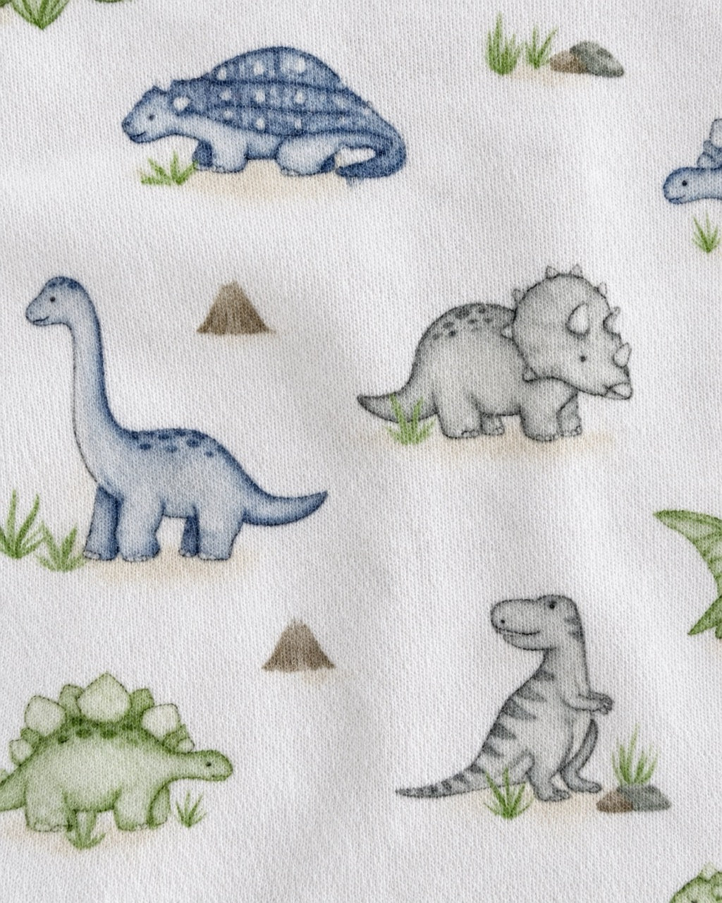 White fabric with a watercolor-style dinosaur print featuring blue, gray, and green dinosaurs, small grass tufts, and brown mounds.