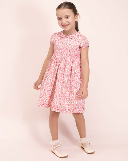 Girl wearing Violette French Blossom Pink Smocked Dress with Cream Shoes and Ruffle Socks 