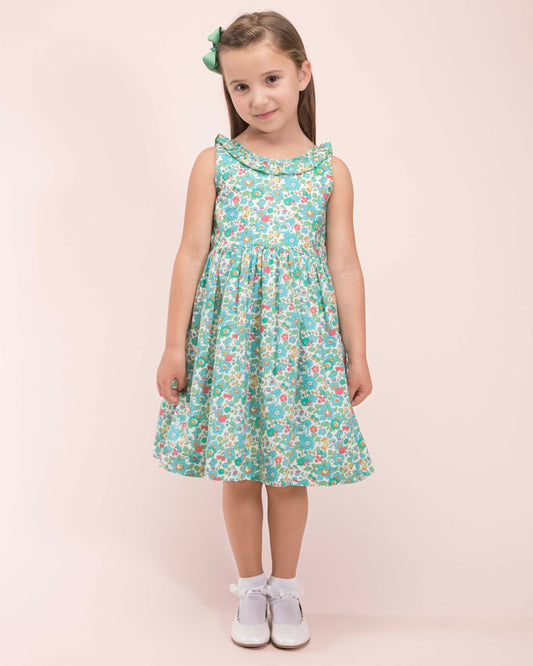 Girl wearing Ella Liberty Betsy Mint Dress with a matching mint hairbow showing the front of the dress 