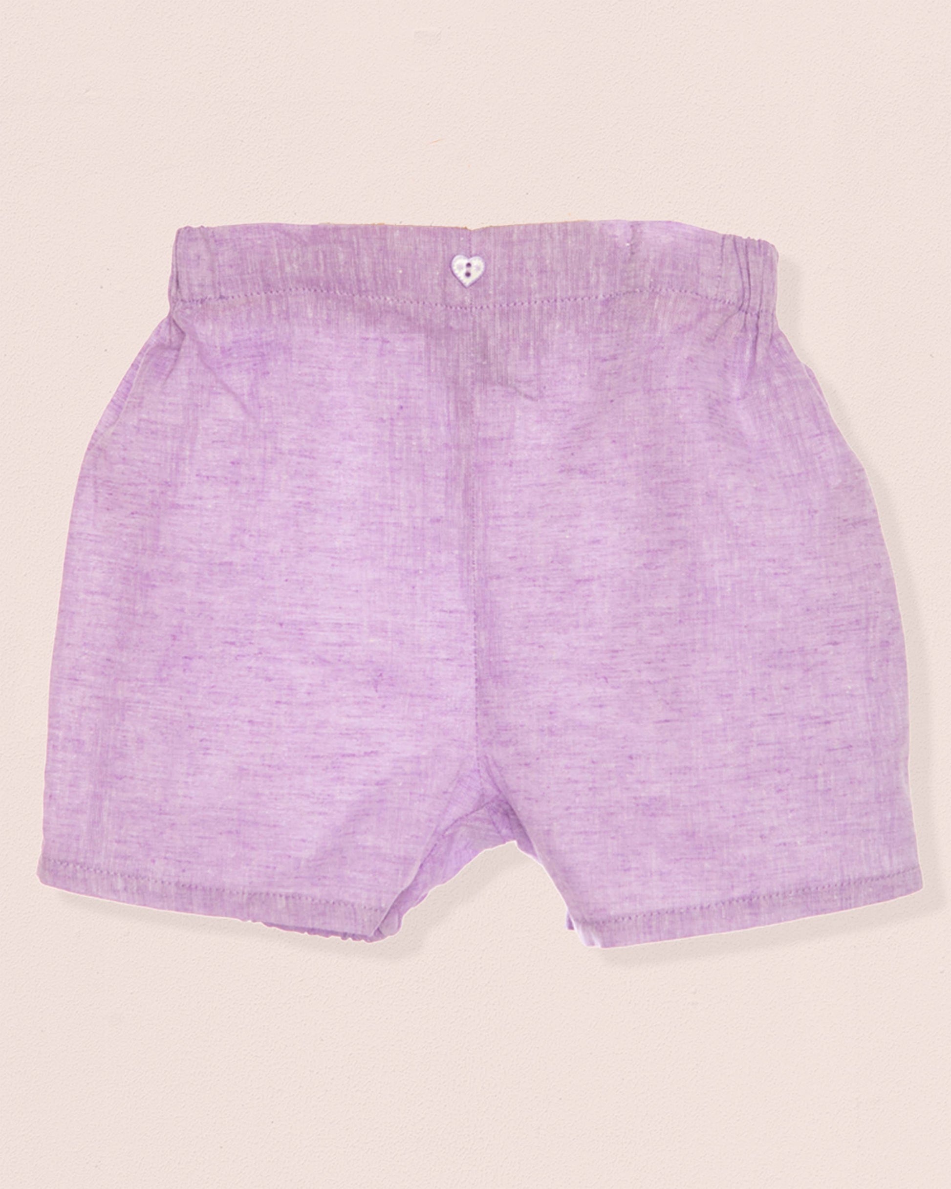 Purple shorts on a beige background
