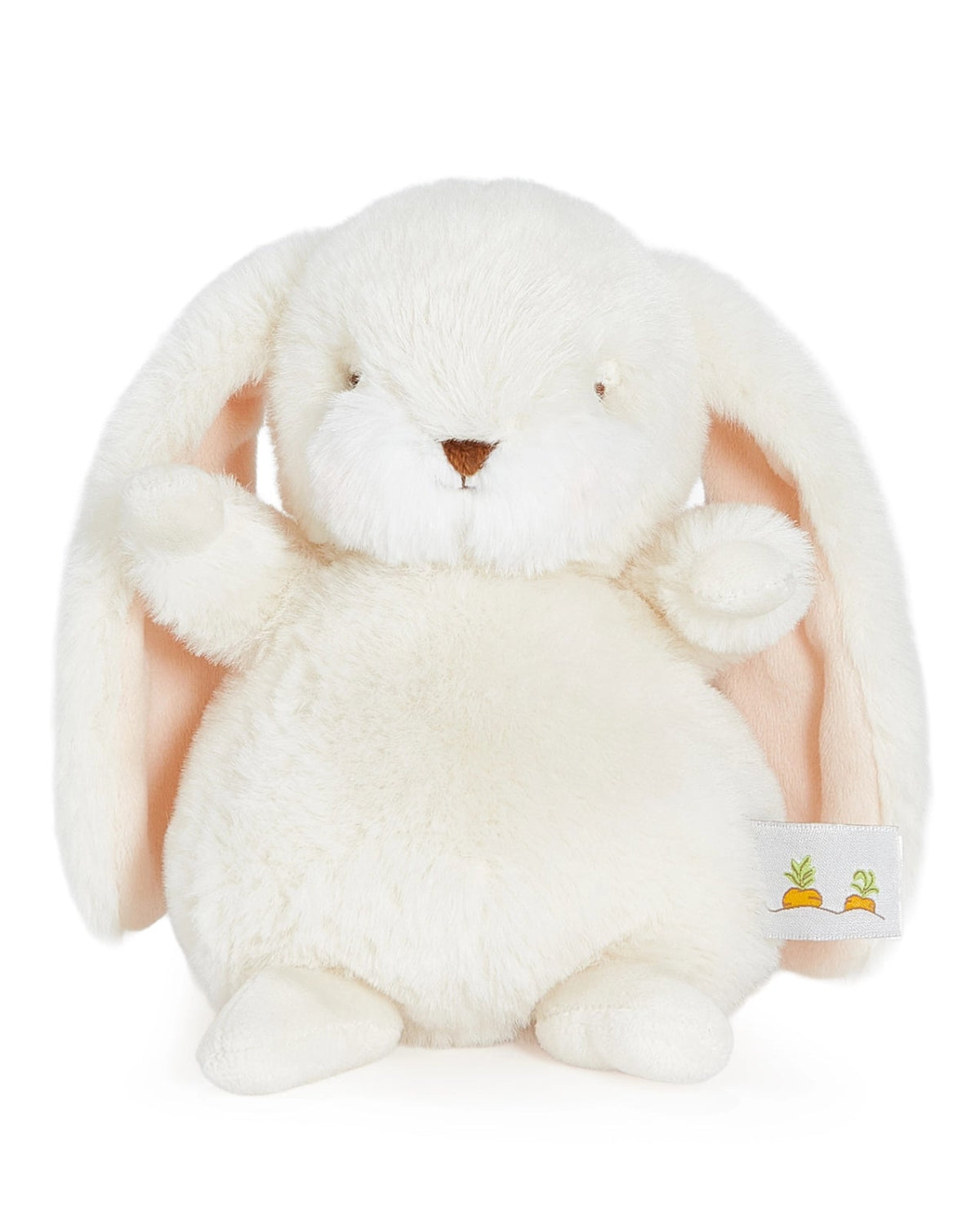 White plush bunny toy with a small carrot on a white background