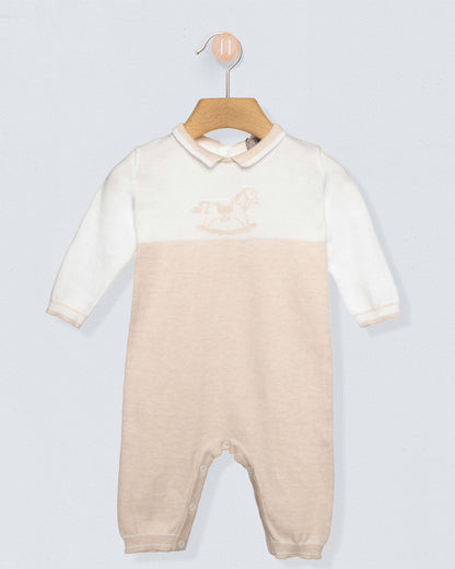 Baby onesie with a gradient design on a hanger against a light gray background