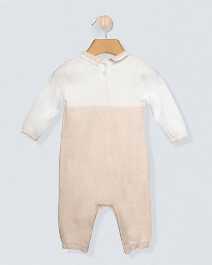 Baby onesie with a gradient design on a hanger against a light gray background