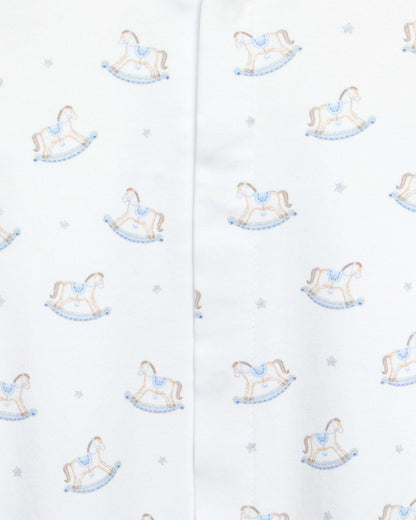 close up of white stretchie with blue and brown rocking horse designs
