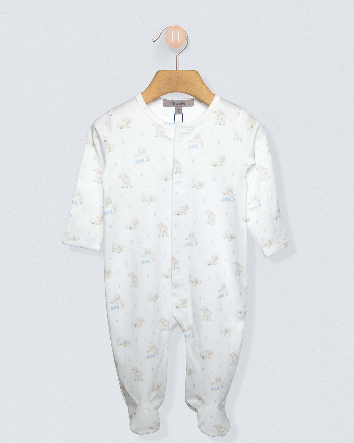 white stretchie with white blue and brown sheep designs, against a white background