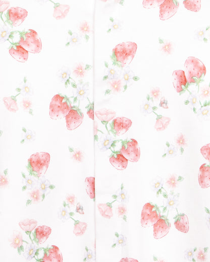 Close up of a white onesie with floral pattern with strawberries