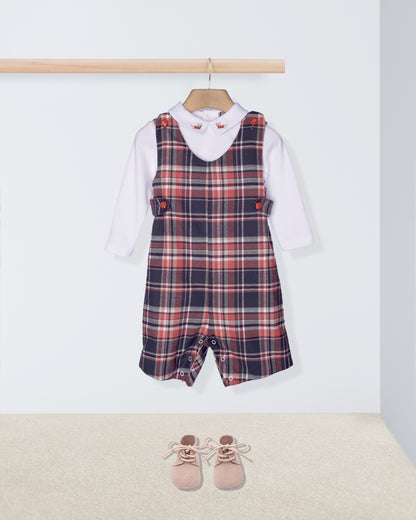 Plaid romper with white shirt and pink shoes on a white background