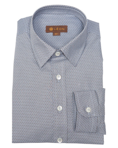 A folded boy's dress shirt featuring a light blue and white micro-patterned fabric, a classic collar, and a single-button chest pocket.