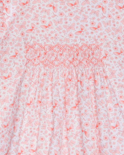 Floral patterned fabric with a pink and white color scheme