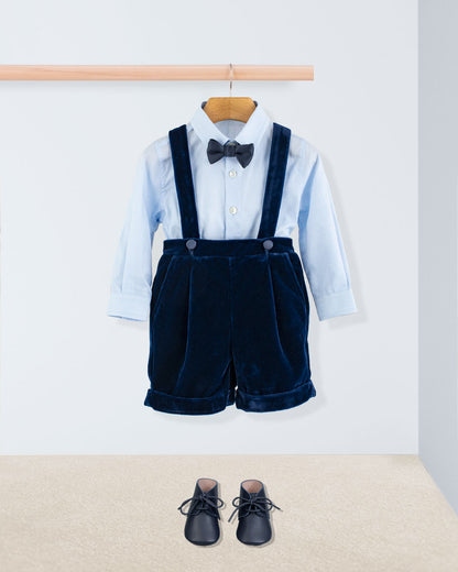 Adam Navy Velvet Suspender Short paired with a light blue shirt, black bow tie, and navy lace-up shoes, showcasing elegant Italian craftsmanship for special occasions.