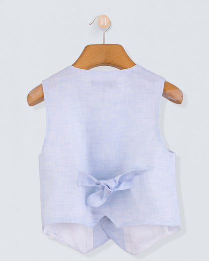 Back view of light blue linen vest with a decorative bow at the waist, shown on a hanger