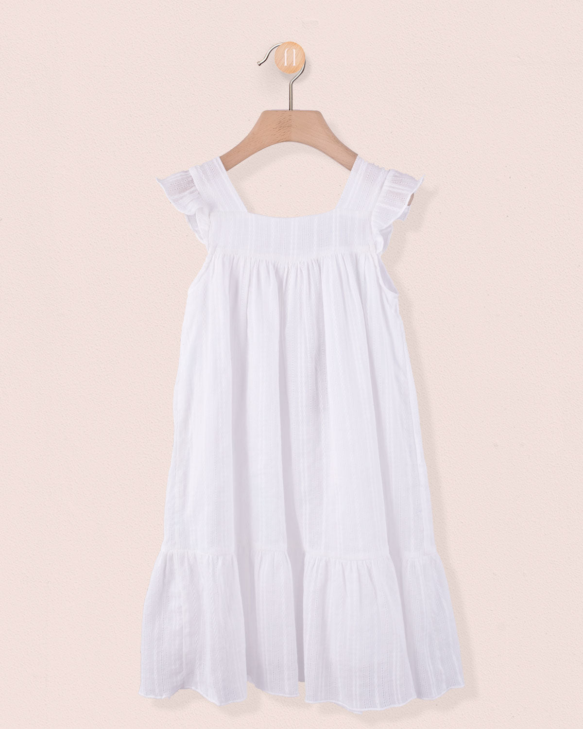 White flutter-sleeve viscose dress with ruffled hem, displayed on hanger against light pink background