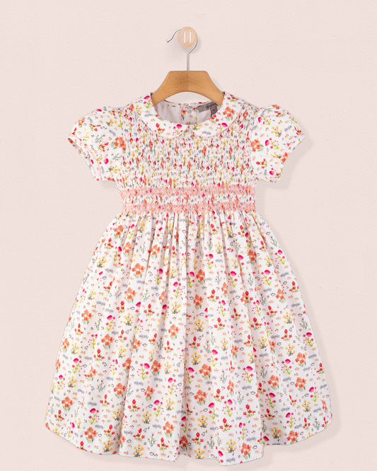 Amanda Happy Garden Smocked Dress front view on hanger in floral print