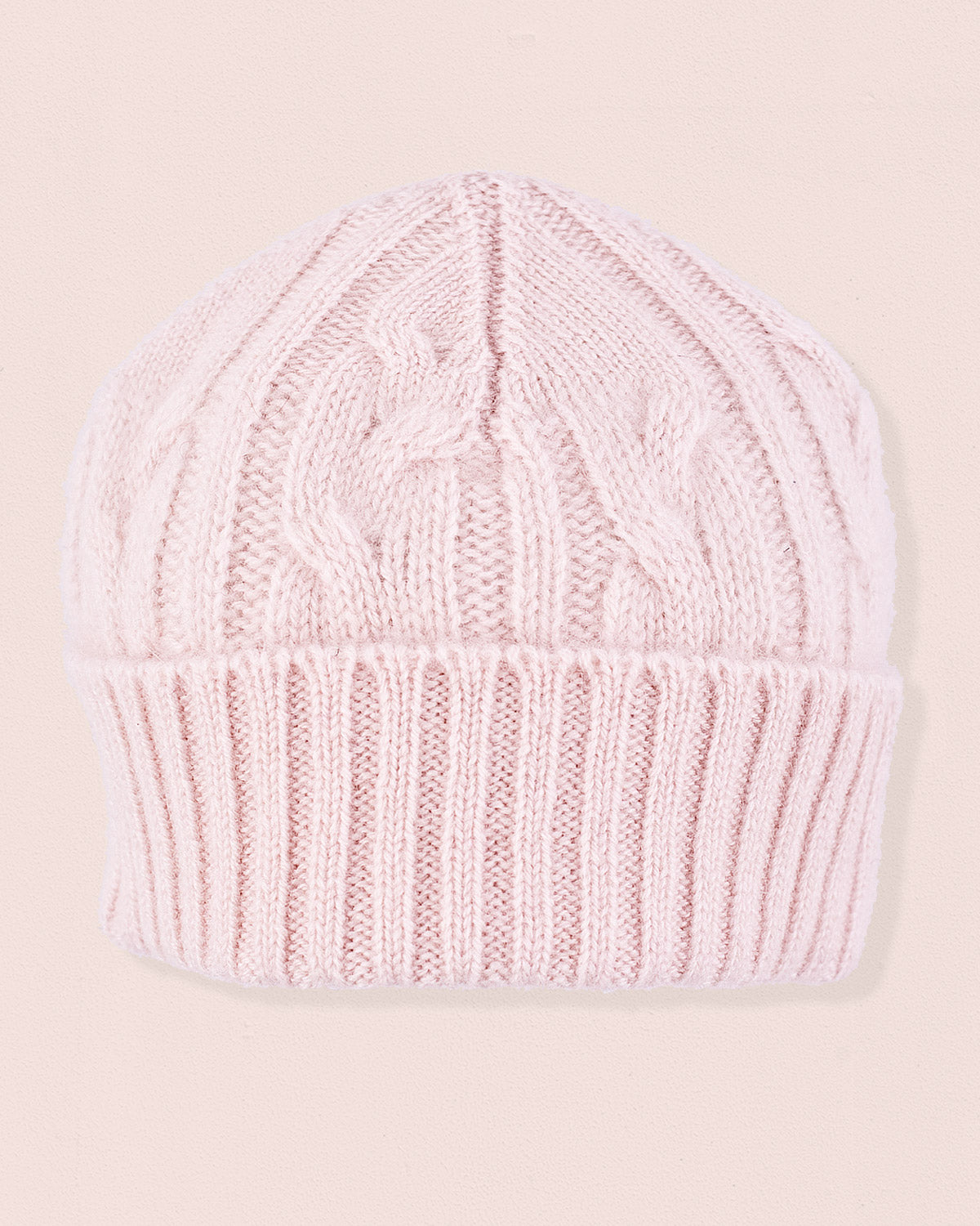 Cashmere Pink Cable Knit Hat with a folded ribbed brim and textured pattern, made from soft Italian cashmere for cozy winter wear.