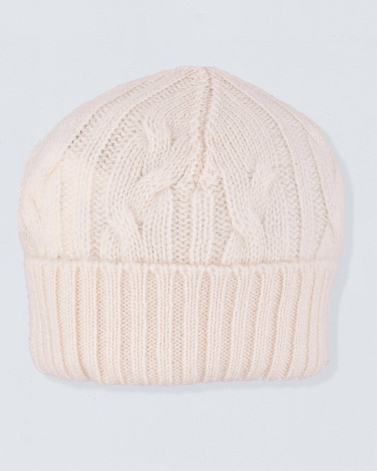Cashmere Cream Cable Knit Hat featuring a cozy cable knit design with a folded ribbed cuff, crafted from soft Italian cashmere for warmth during winter.