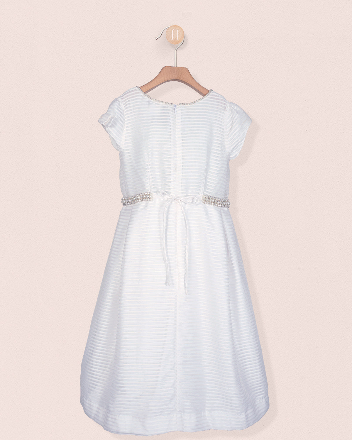 Back view of the Angelica White Organza Gown showing a sash tie and zipper with pearl trim around the waist