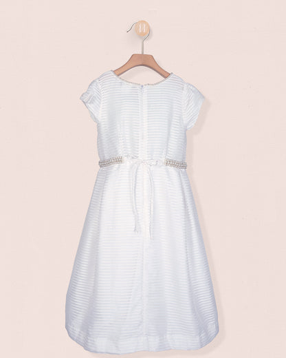 Back view of the Angelica White Organza Gown showing a sash tie and zipper with pearl trim around the waist