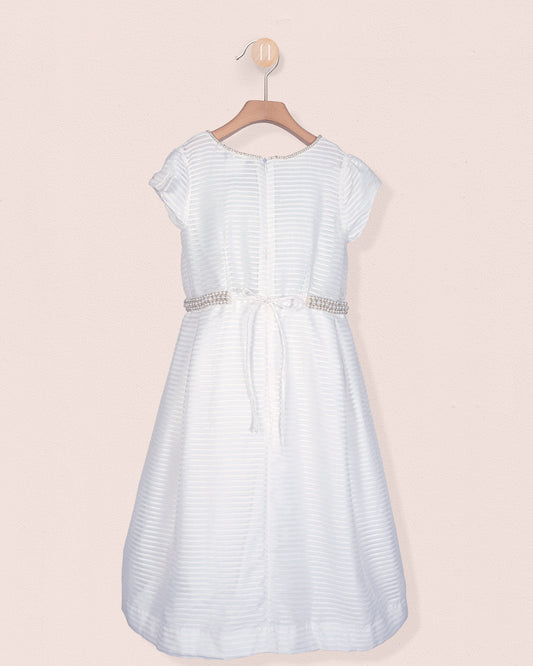 Back view of the Angelica White Organza Gown showing a sash tie and zipper with pearl trim around the waist