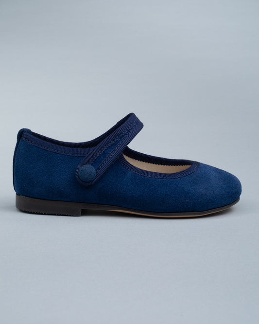 Side profile of a single Elizabeth Twilight Blue Suede Mary-Jane shoe showing velcro strap and soft suede texture.