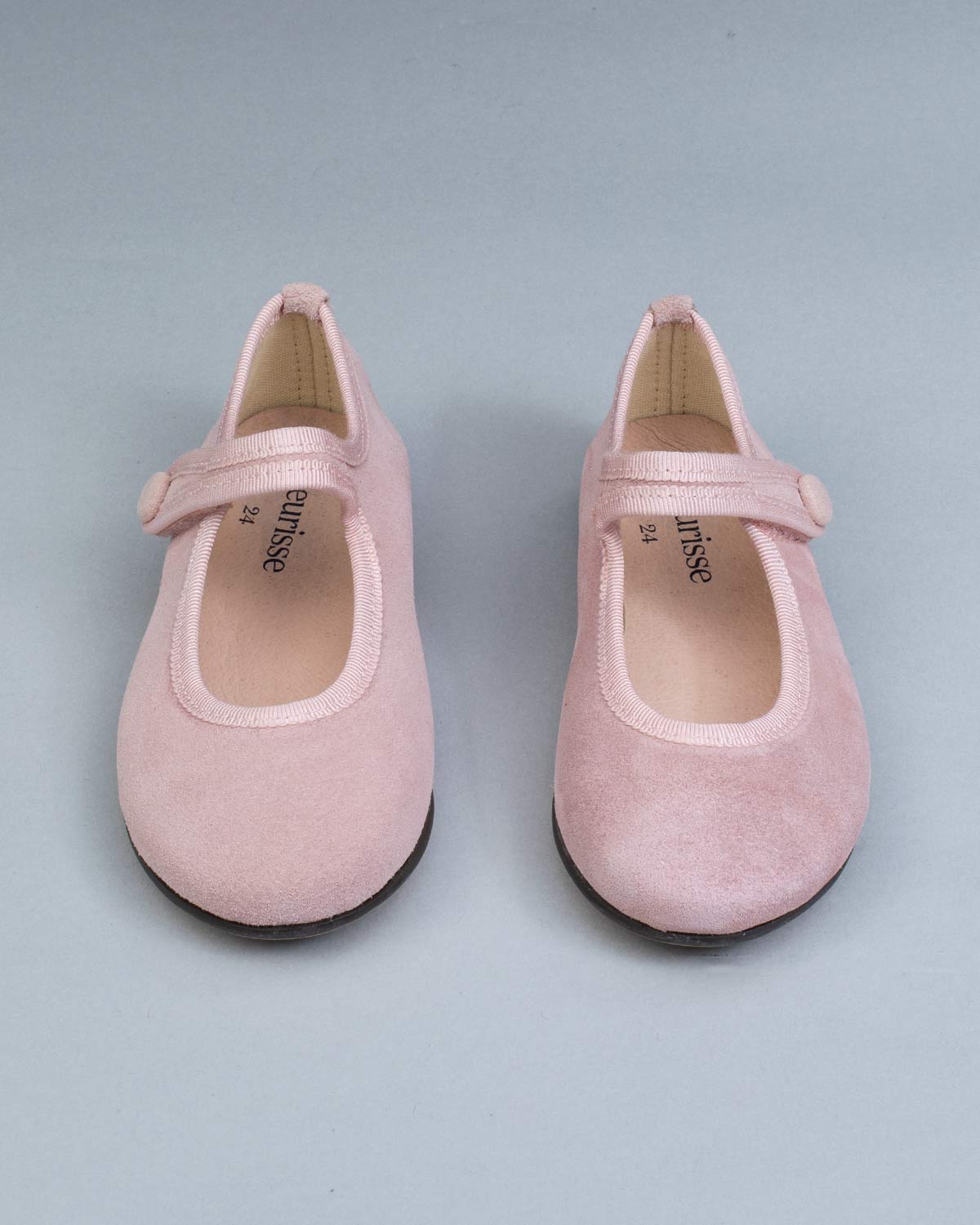Top view of Elizabeth Pink Suede Mary-Jane shoes showing insoles and secure velcro straps, laid out evenly.