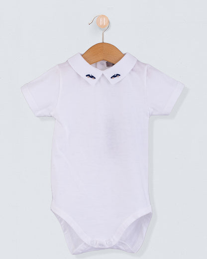 Front view of the Andreas Baby Onesie, a short-sleeve white cotton jersey bodysuit with a pointed collar featuring embroidered navy cars.